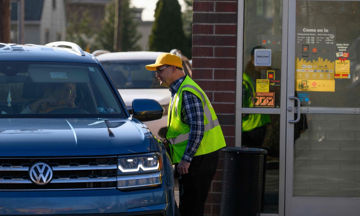 Customers use the drive-thru at the Altoona McDonald's on East Plank Road where murder suspect Luigi Mangione was identified and later arrested on December 9, 2024 in Altoona, Pennsylvania. Photo by JEFF SWENSEN / GETTY IMAGES NORTH AMERICA / Getty Images via AFP