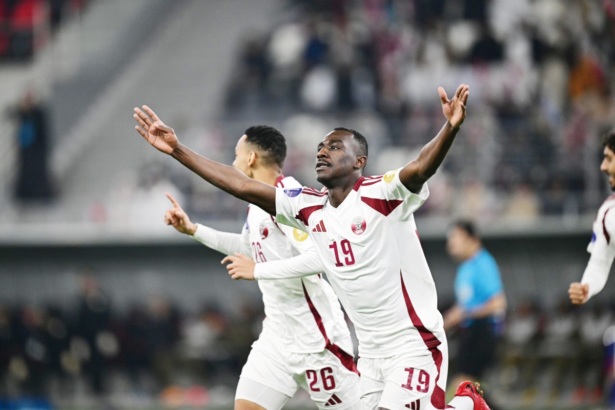 Qatar's Almoez Ali celebrates after scoring the opening goal of the match.