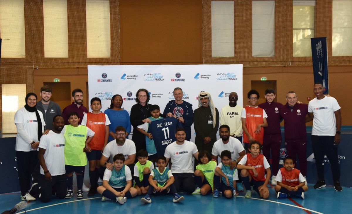 Caption for Group photo: Officials of Qatar Foundation, Generation Amazing Foundation, Paris Saint-Germain, and the participants pose for a photograph at the launch of the first international launch of PSG’s ‘One Team - Onze de Légende’ programme at the Education City in Doha, yesterday. All pictures: Salim Matramkot/The Peninsula 