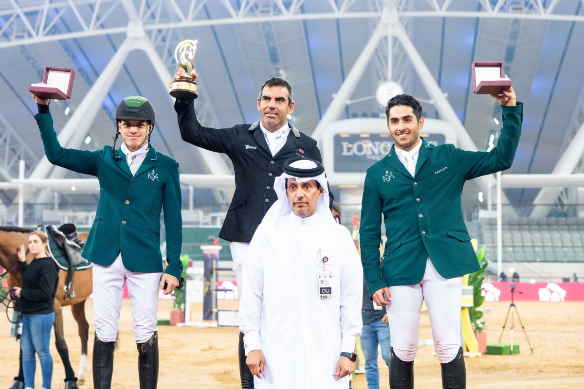 Al Shaqab Corporate Services Director Hamza Al Kuwari poses for a photo with the podium winners of the The World Cup qualifying CSI4*-W - Faults & Time - 1.45m (LR) class Mariano Martinez Bastida (top centre), Abdullah Alsharbatly (left) and Abdulrahman Alrajhi.