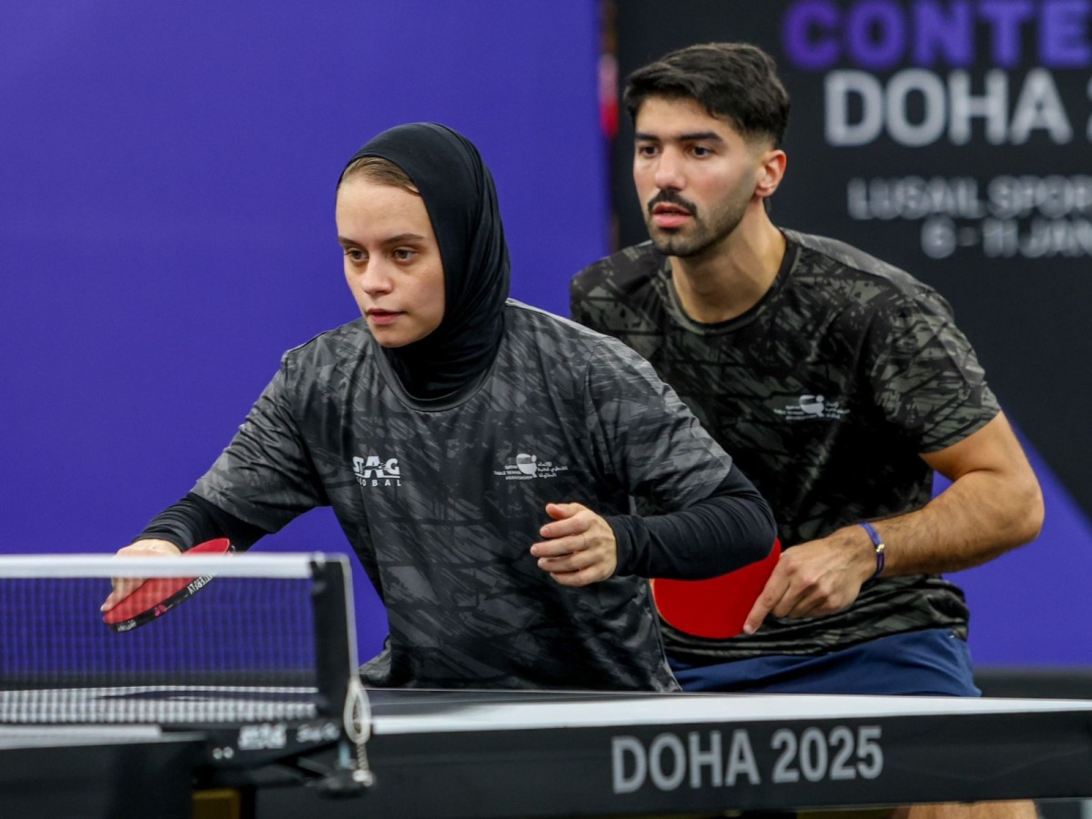 Qatar's Aya Mohamed (left) and Mohamed Abdelwahhab in action during their quarter-final yesterday.