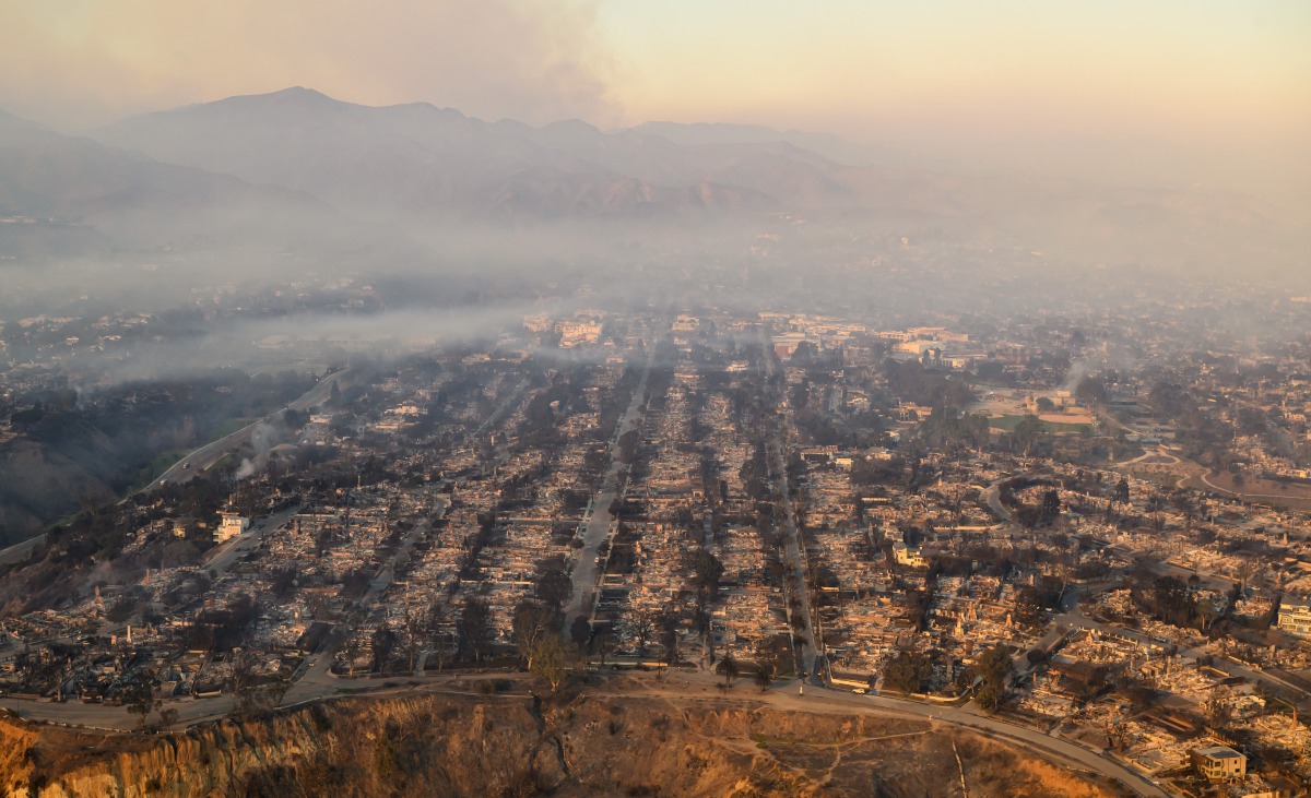 In this aerial view taken from a helicopter, burned homes are seen from above during the Palisades fire near the Pacific Palisades neighborhood of Los Angeles, California on January 9, 2025. Photo by JOSH EDELSON / AFP