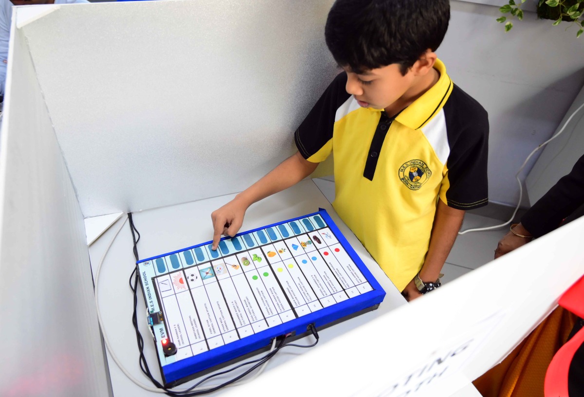 A student casting his vote.