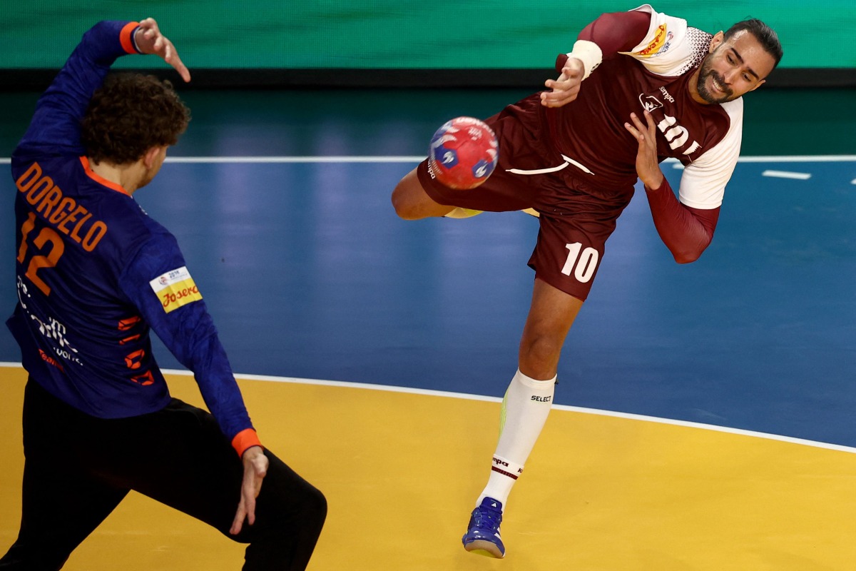 Qatar’s Frankis Marzo (right) shoots to score a goal against Netherlands. AFP