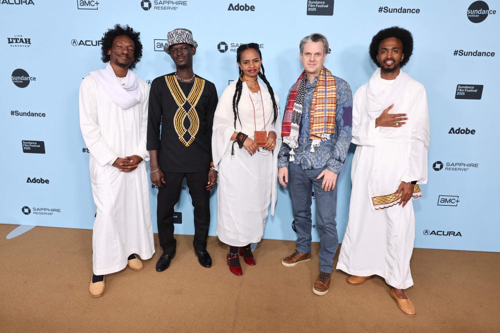 (From left) Ibrahim Snoopy Ahmad, Anas Saeed, Rawia Alhag, Phil Cox and Timeea Mohamed Ahmed attend the 'Khartoum' premiere during the 2025 Sundance Film Festival at Egyptian Theatre on January 27, 2025 in Park City, Utah. (Photo by Cindy Ord/Getty Images/AFP)