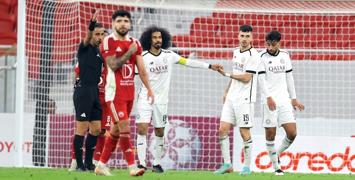 Al Sadd's Akram Afif (centre) and Rafa Mujica (second right) celebrate during the match.