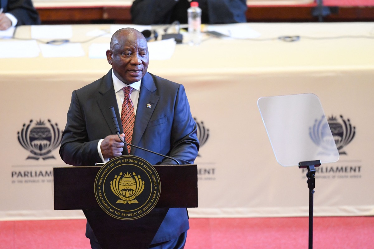 South African President Cyril Ramaphosa delivers the State of the Nation address at the Cape Town City Hall on February 6, 2025. (Photo by Rodger Bosch / AFP)
