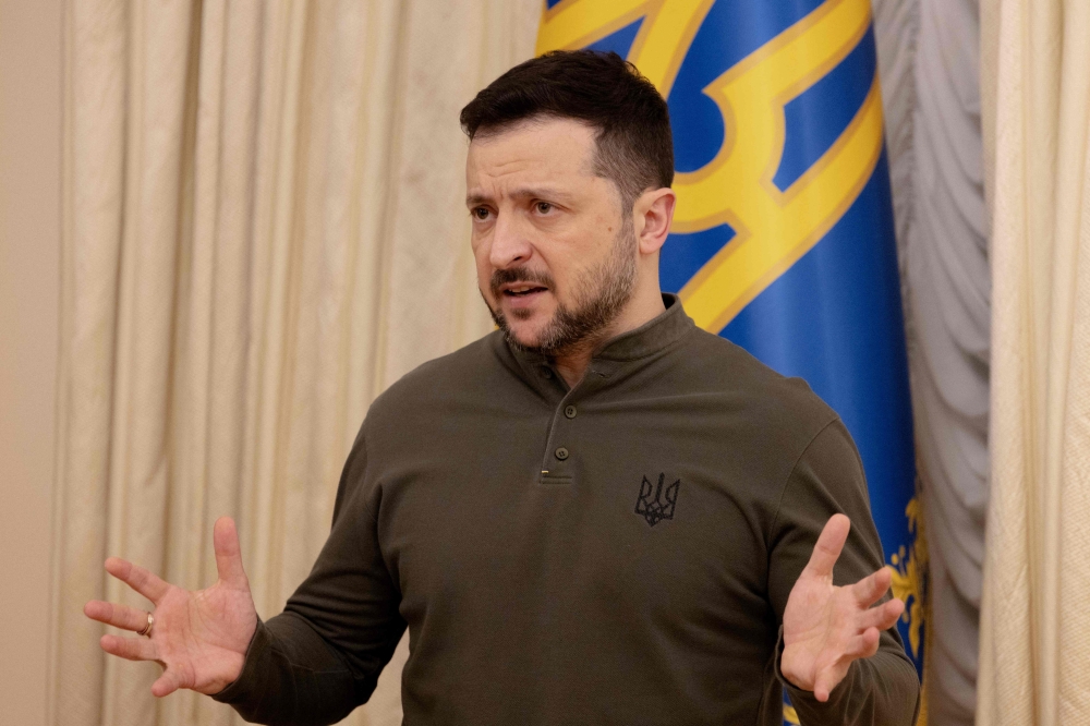 Ukraine's President Volodymyr Zelensky speaks during a joint press conference with the President of the European Investment Bank (EIB) in Kyiv on February 10, 2025. (Photo by Tetiana Dzhafaroav / AFP)
