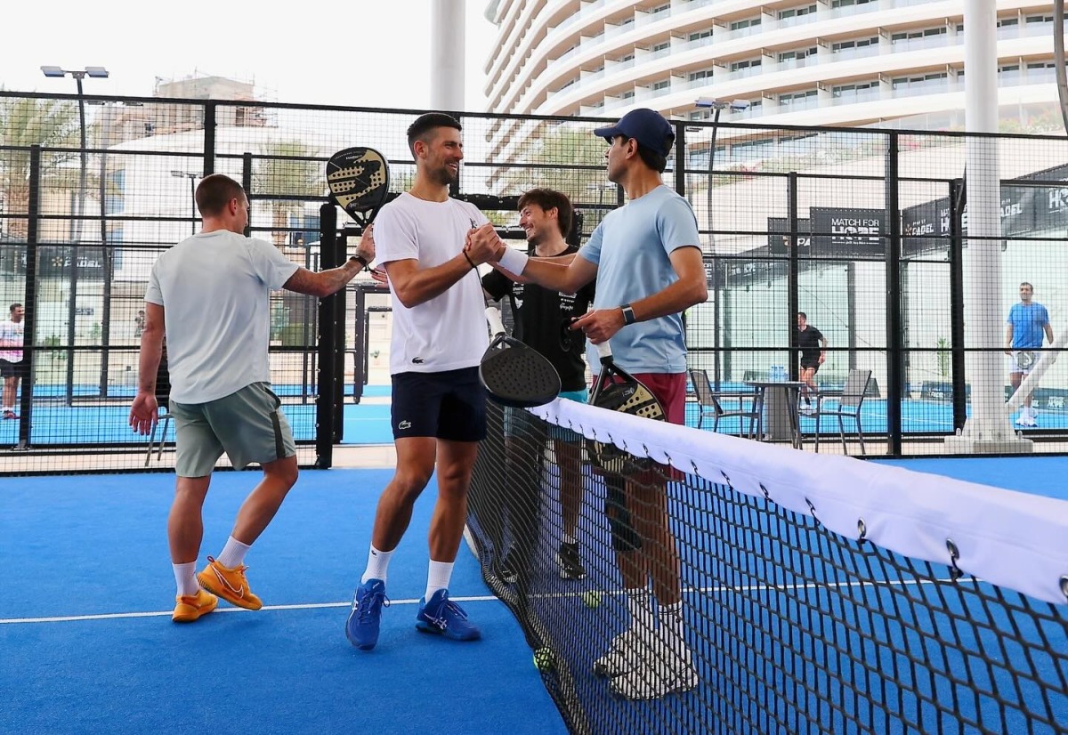 Qatar Tennis Federation President Nasser Al Khelaifi and Novak Djokovic shake hands following their friendly padel match yesterday.