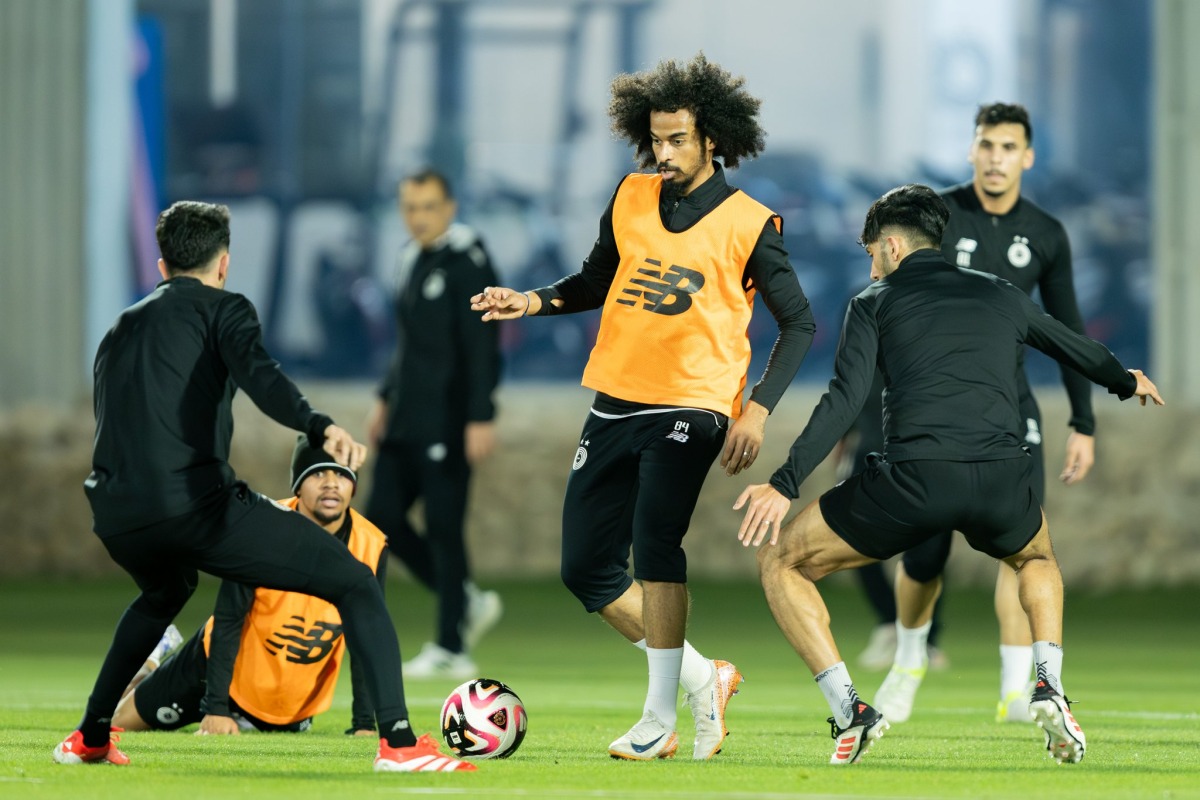 Al Sadd's Akram Afif (centre) during team's training session.