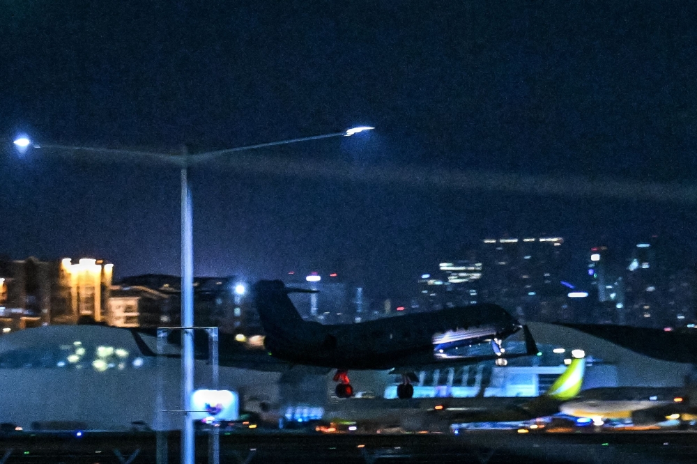 The Learjet carrying former Philippine president Rodrigo Duterte, takes off from Villamor Air Base in Pasay, Metro Manila on March 11, 2025. (Photo by Jam Sta Rosa / AFP)
