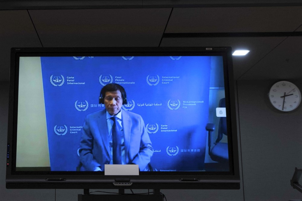 Former Philippine President Rodrigo Duterte is seen on a screen in the courtroom during his first appearance before the International Criminal Court (ICC) in The Hague on March 14, 2025. (Photo by Peter Dejong / POOL / AFP) 