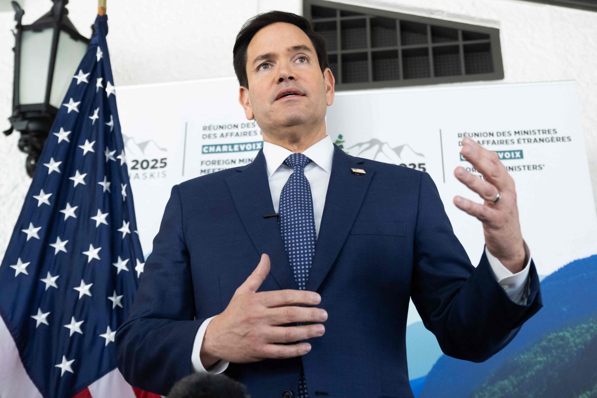 US Secretary of State Marco Rubio speaks with reporters following the G7 foreign ministers meeting in La Malbaie, Quebec, on March 14, 2025. (Photo by SAUL LOEB / POOL / AFP)
