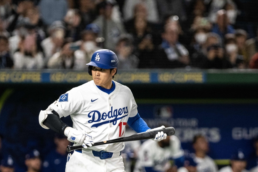 Los Angeles Dodgers' Shohei Ohtani prepares to bat in the exhibition baseball match between the Los Angeles Dodgers and Yomiuri Giants during the MLB Tokyo Series at the Tokyo Dome in Tokyo on March 15, 2025. (Photo by Philip FONG / AFP)
 