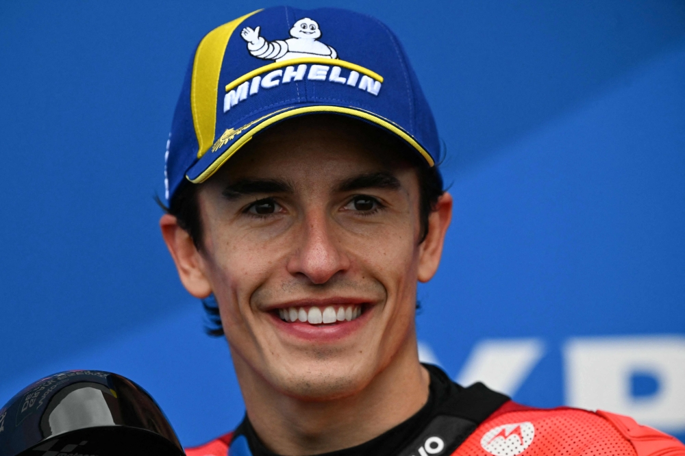 Ducati Lenovo's Spanish rider Marc Marquez gestures after getting pole position in the MotoGP Argentina Grand Prix qualifying session at the Termas de Rio Hondo circuit in Santiago del Estero, Argentina on March 15, 2025. (Photo by Luis Robayo / AFP)
 