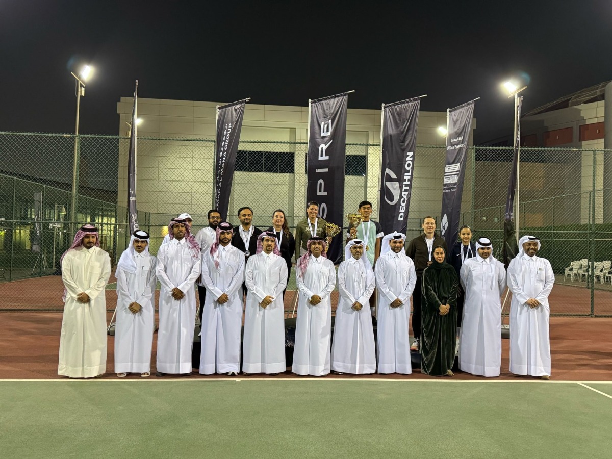 Officials with the winners at the awards ceremony. 