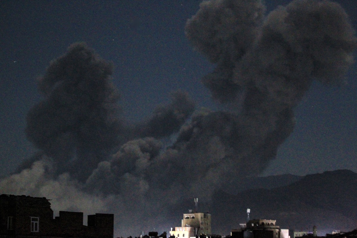 A plume of smoke billows during a US strike on Yemen's Huthi-held capital Sanaa early on March 16, 2025. Photo by Mohammed HUWAIS / AFP.