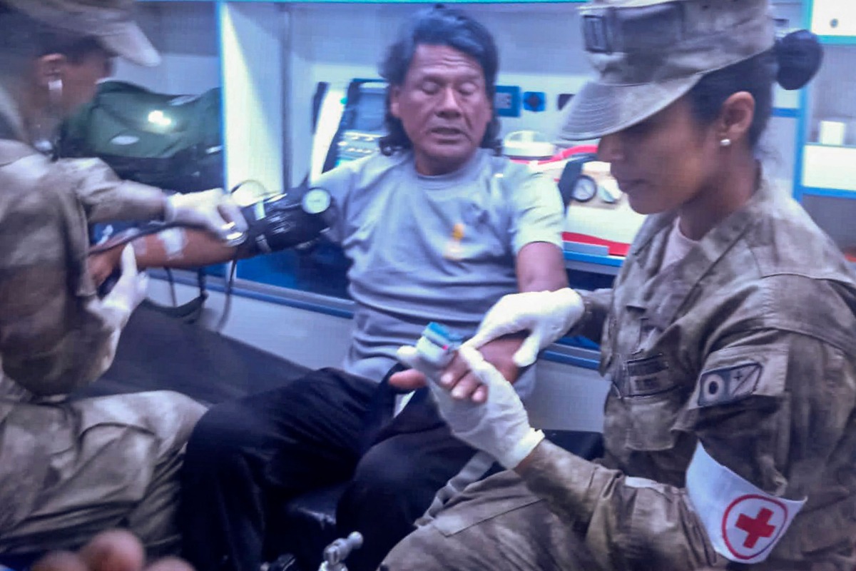 This handout picture released on March 15, 2025, by the Peruvian Navy shows Peruvian fisherman Maximo Napa, 61, receiving medical attention upon his arrival in Paita, Piura department, Peru. Photo by Handout / PERUVIAN NAVY / AFP