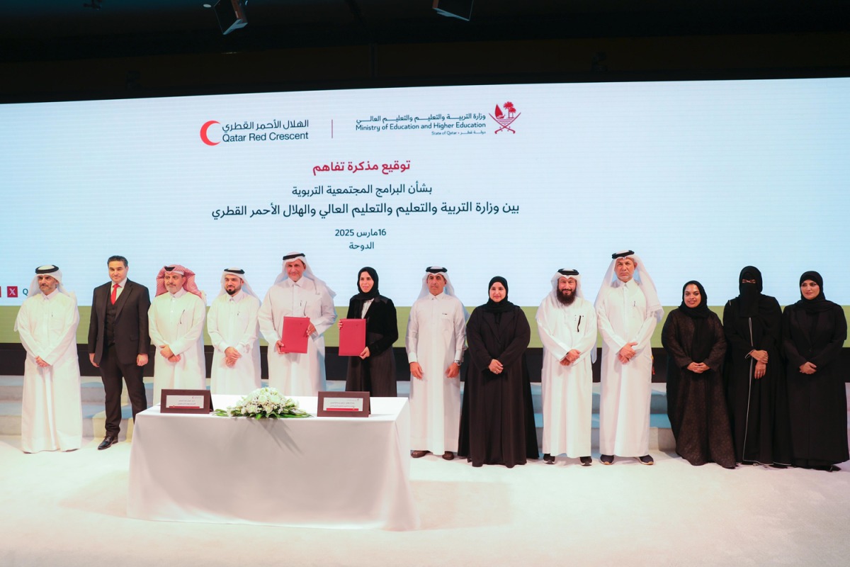 Minister of Education and Higher Education H E Lolwah bint Rashid Al Khater and QRCS President Yousef bin Ali Al Khater with other officials during the signing ceremony.