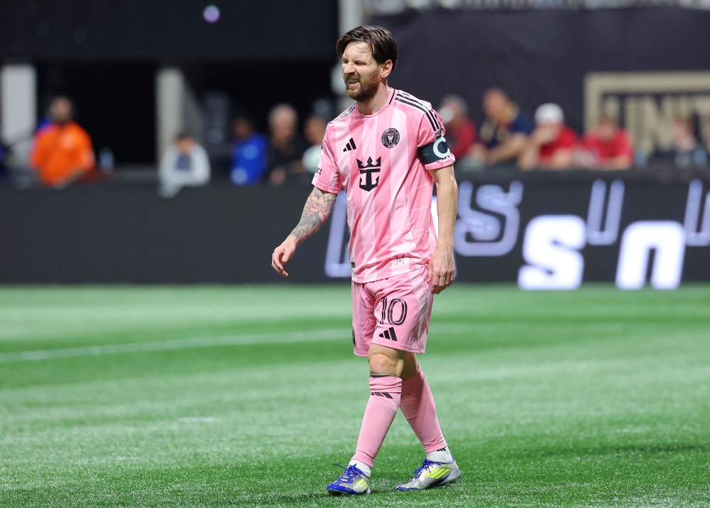 Lionel Messi #10 of Inter Miami CF reacts during the MLS match between Atlanta United and Inter Miami CF at Mercedes-Benz Stadium on March 16, 2025 in Atlanta, Georgia. Kevin C. Cox/Getty Images/AFP