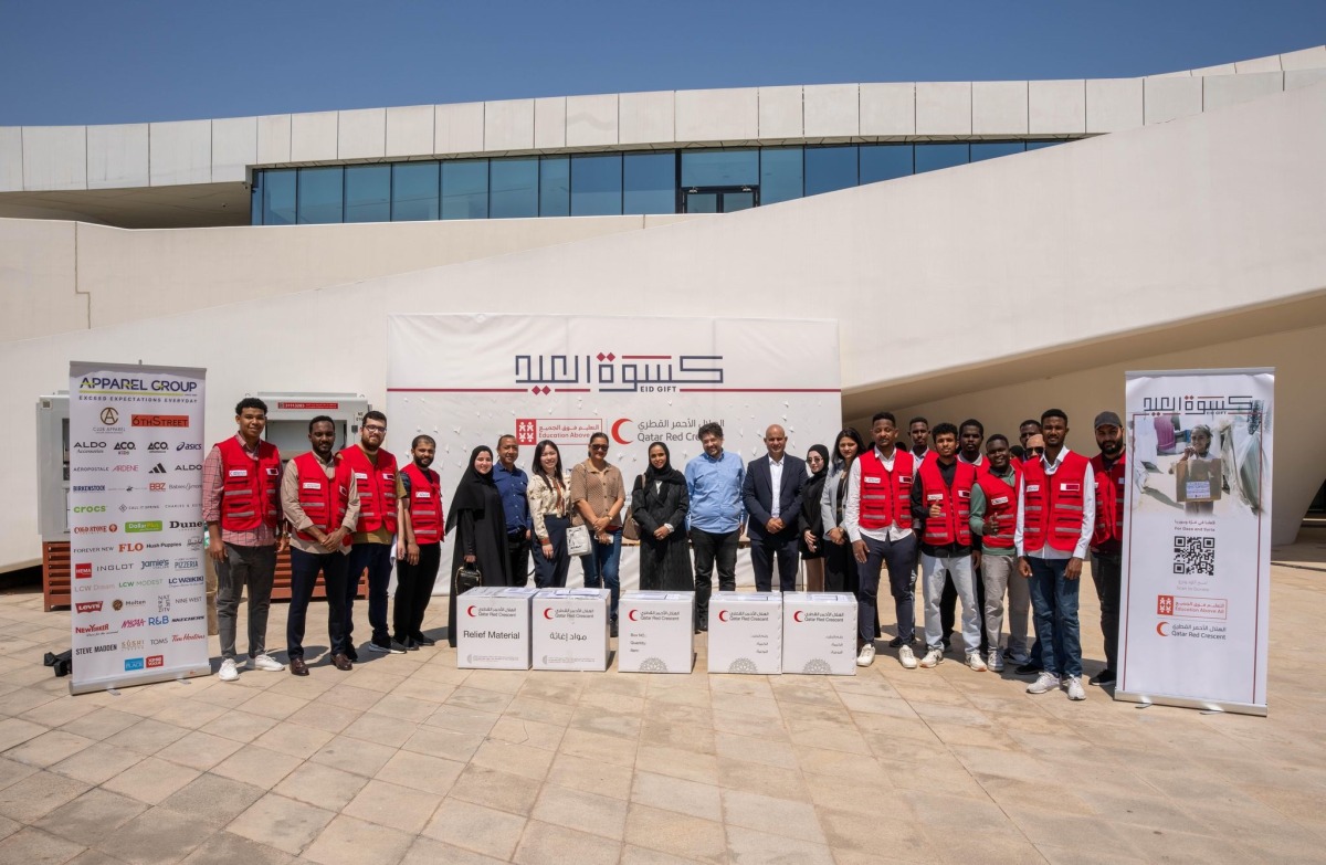 Officials and volunteers with the donated items.