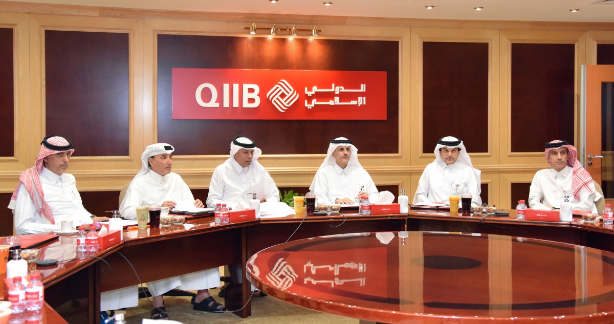 Chairman of the Board of Directors of QIIB, Sheikh Dr. Khalid bin Thani bin Abdullah Al Thani; CEO of QIIB, Dr. Abdulbasit Ahmad Al Shaibei with other officials during the Ordinary and Extraordinary General Assembly Meeting, yesterday.