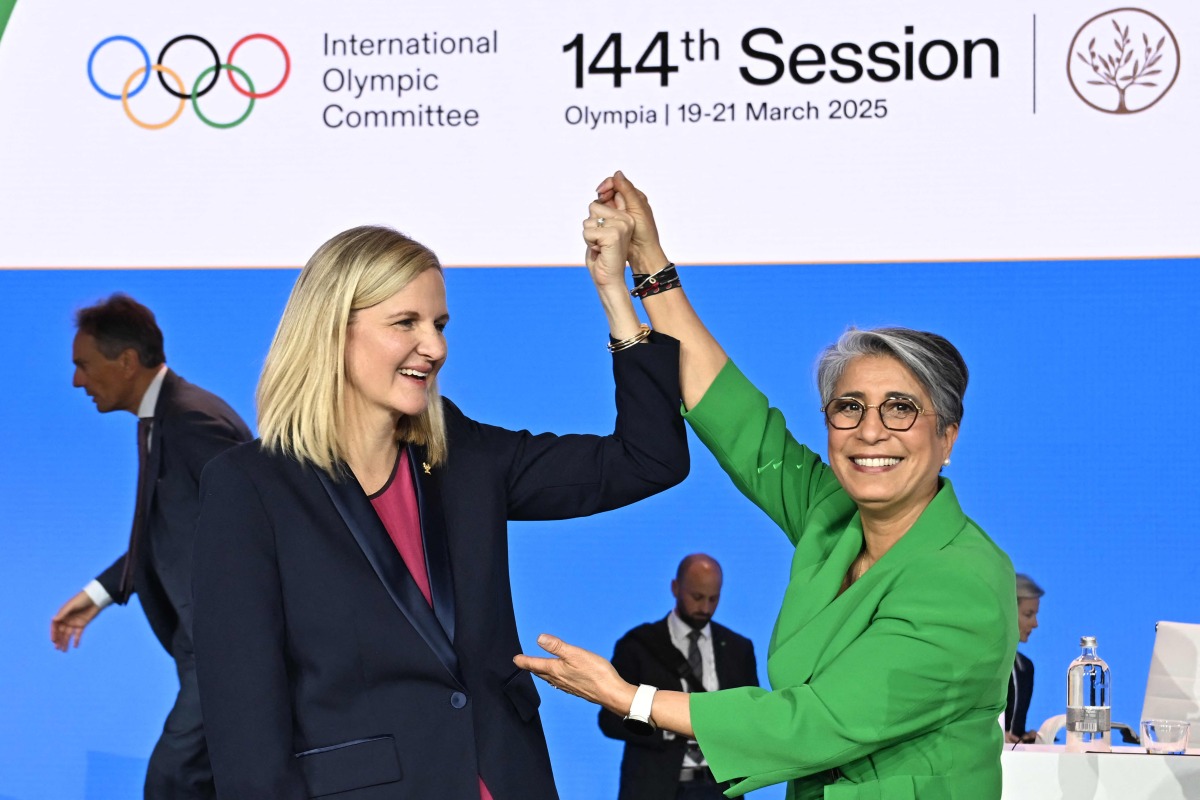 Kirsty Coventry (left) is congratulated by Moroccan former athlete Nawal El Moutawakel after being elected as the new President during the 144th IOC Session.