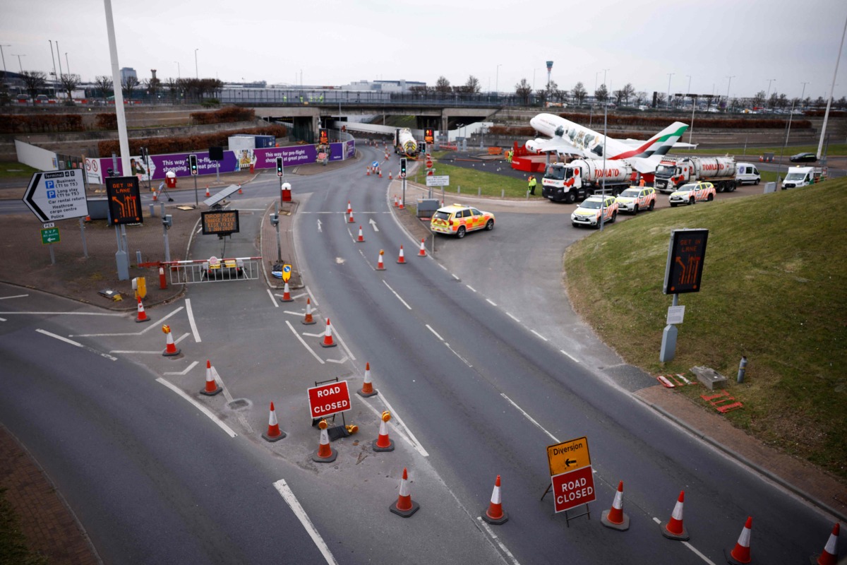 A photograph taken on March 21, 2025 shows road signs reading 