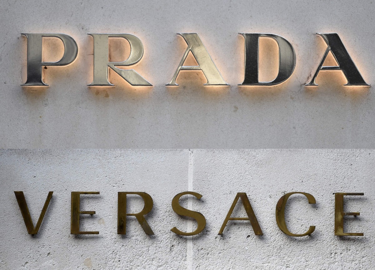 This combination of pictures created on April 10, 2025 shows a file picture of a logo outside the fashion house and luxury goods Versace shop on the Avenue Montaigne in Paris. Photo by STEPHANE DE SAKUTIN / AFP