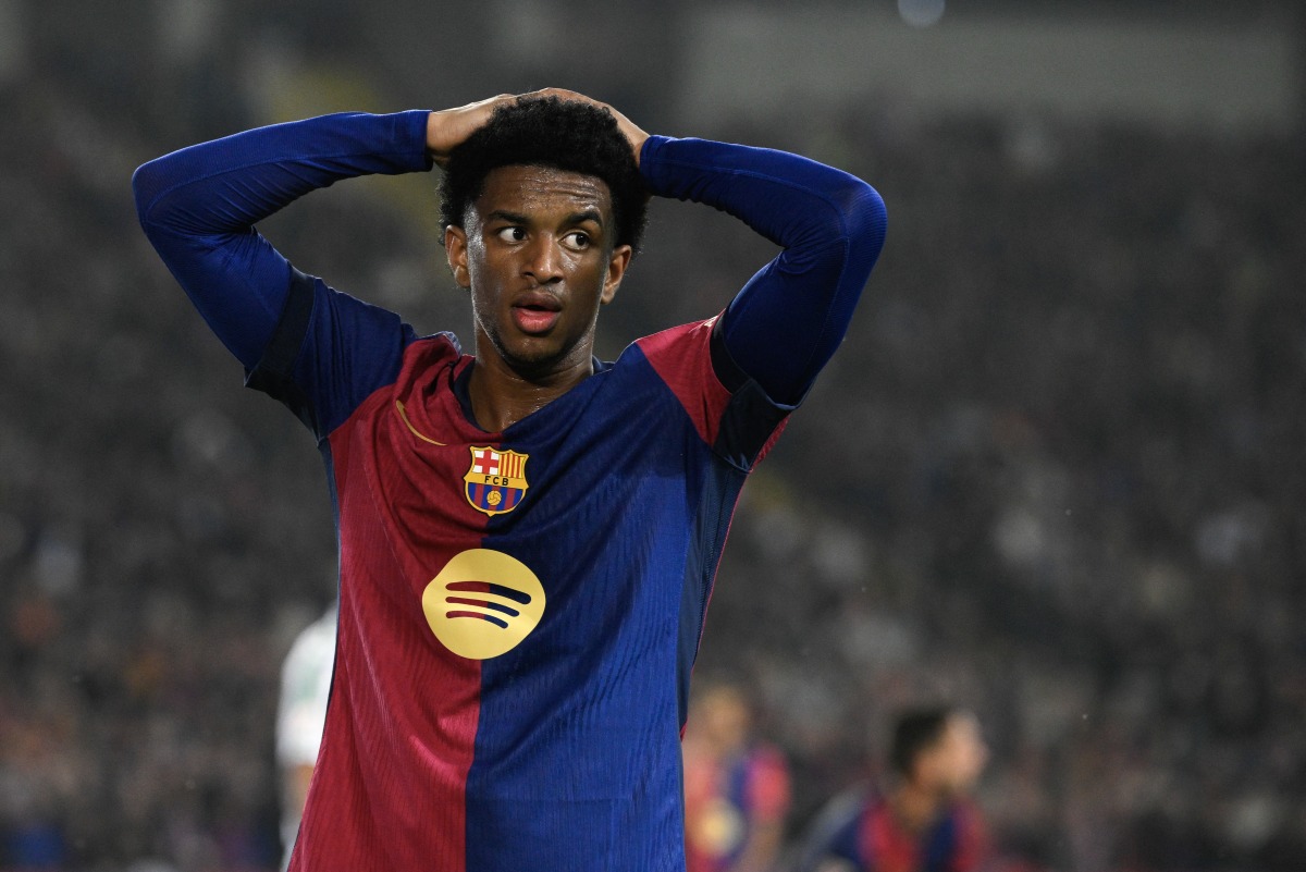 Barcelona's Spanish defender #03 Alex Balde reacts after missing a chance to score during the Spanish league football match between FC Barcelona and Real Betis at the Estadi Olimpic Lluis Companys in Barcelona, on April 5, 2025. (Photo by Josep LAGO / AFP)
