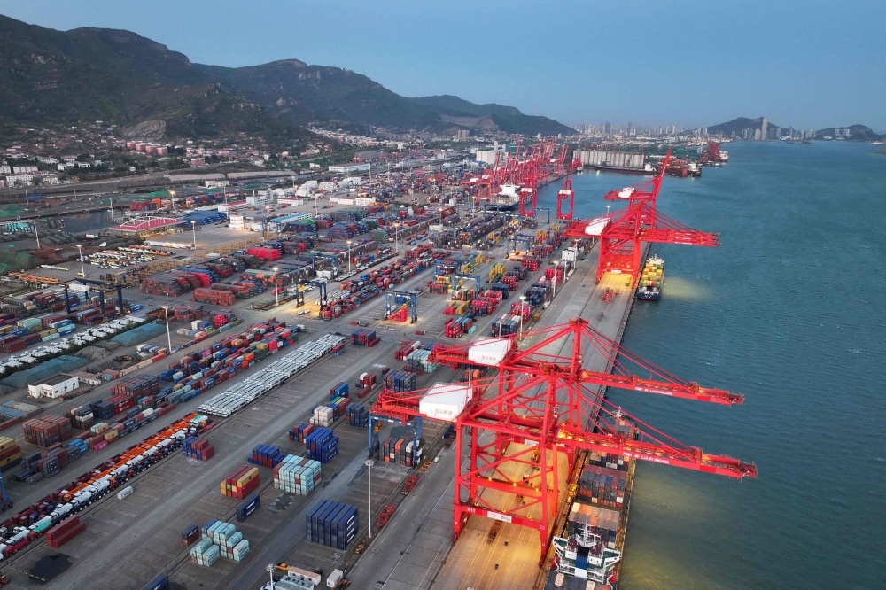 Containers and cranes are seen at the container port in Lianyungang, in China's eastern Jiangsu province on April 13, 2025. (Photo by AFP) 
 