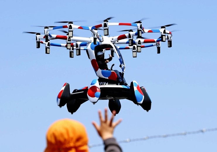 A flying vehicle makes its debut flight in front of visitors at the 2025 Osaka-Kansai Expo on Monday. Photo by The Japan News via Washington Post

